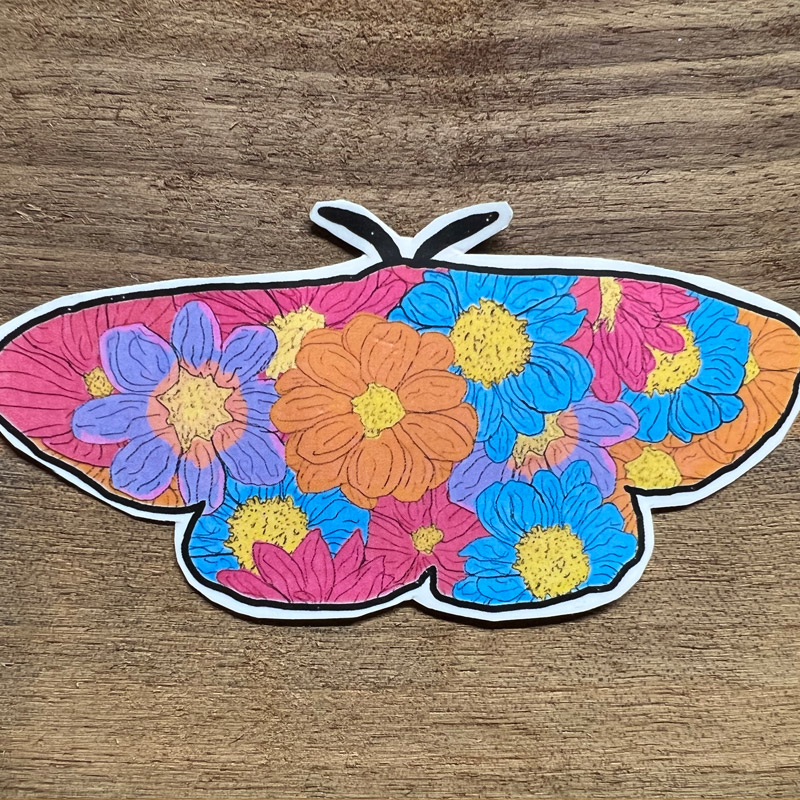 sticker of a moth filled with colorful hand drawn flowers
